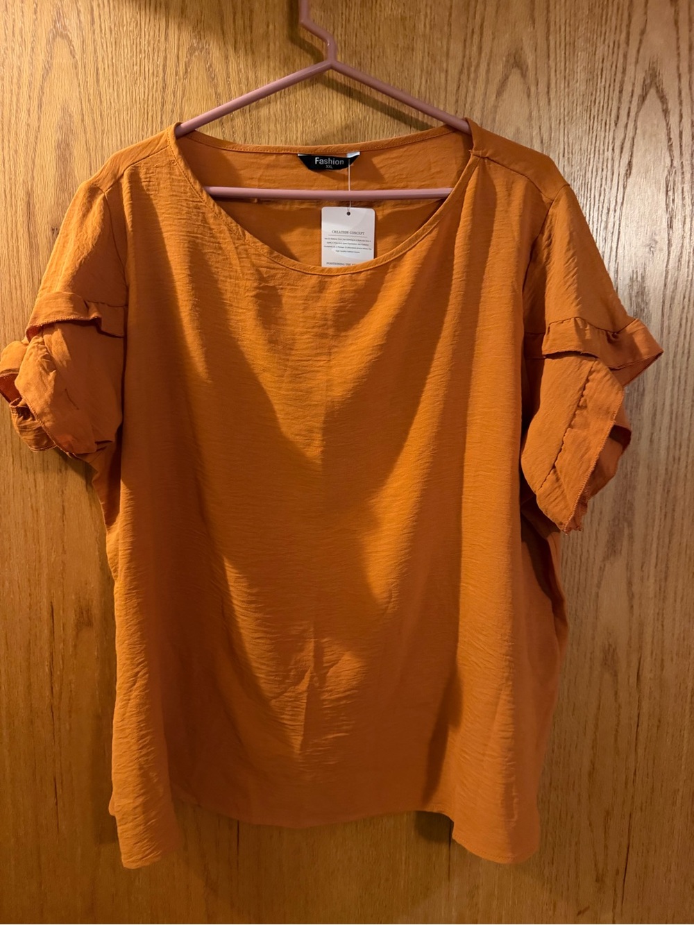 Women's Orange Short Sleeve Ruffle sleeve Top.